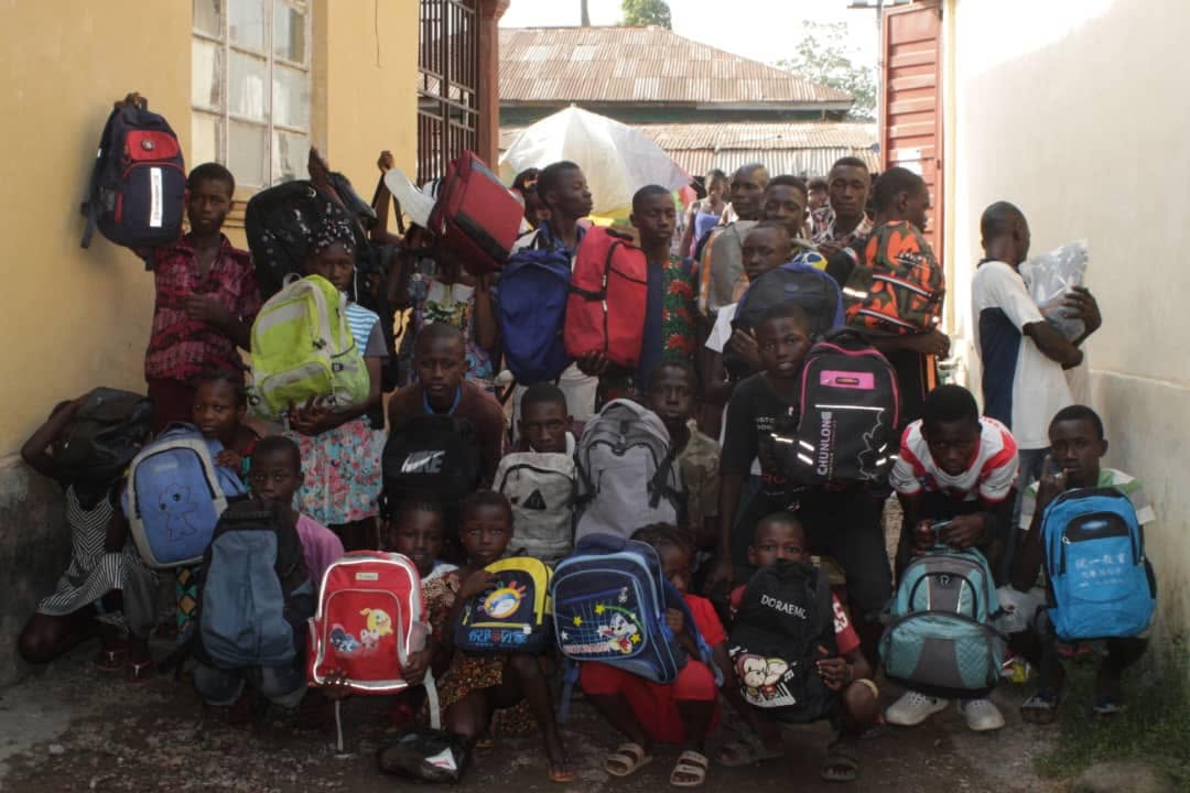 Children with newly provided school bags